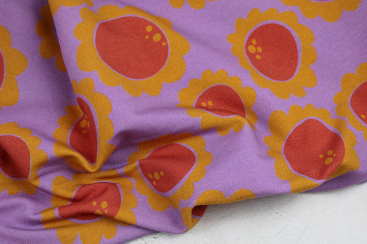 Sweatstoff Beginning mit Retroblumen in Lila, Rot und Ocker