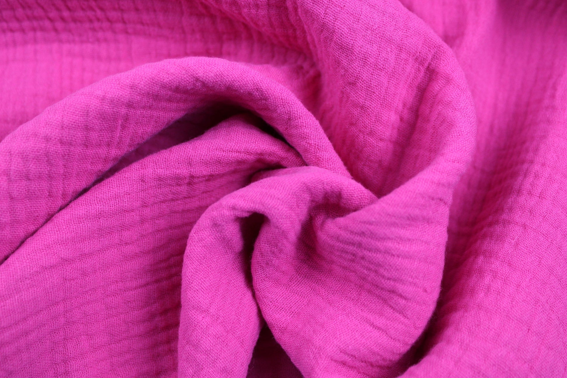 Musselinstoff Jenke uni pink gedreht