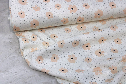 Wollweißer Rippjersey Jena mit kleinen Blüten in Apricot Ballenansicht