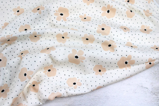 Wollweißer Rippjersey Jena mit kleinen Blüten in Apricot