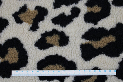 Teddystoff mit Leoprint in beige Maßstab