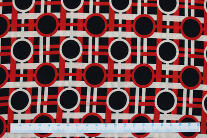 Viskosestoff mit Retromuster in rot-schwarz-beige Maßstab