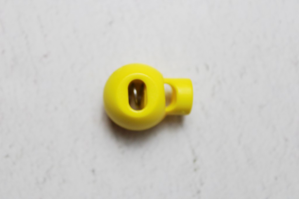 Kordelstopper 1-loch, 18mm rund aus Kunststoff, gelb